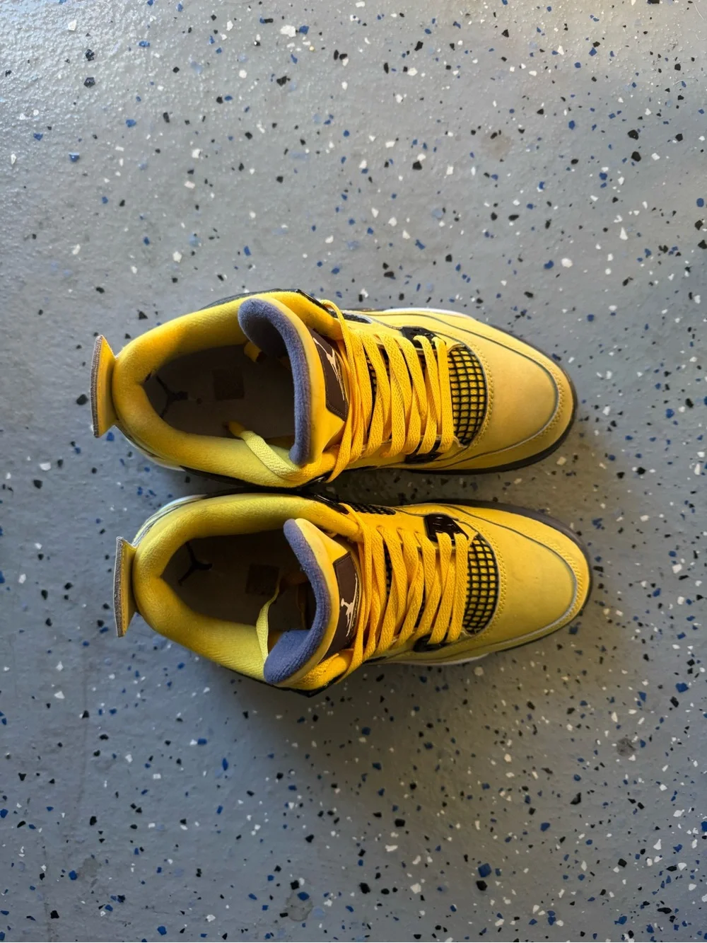 Jordan Yellow and Black Retro 4 Sneakers “Yellow Lightning”